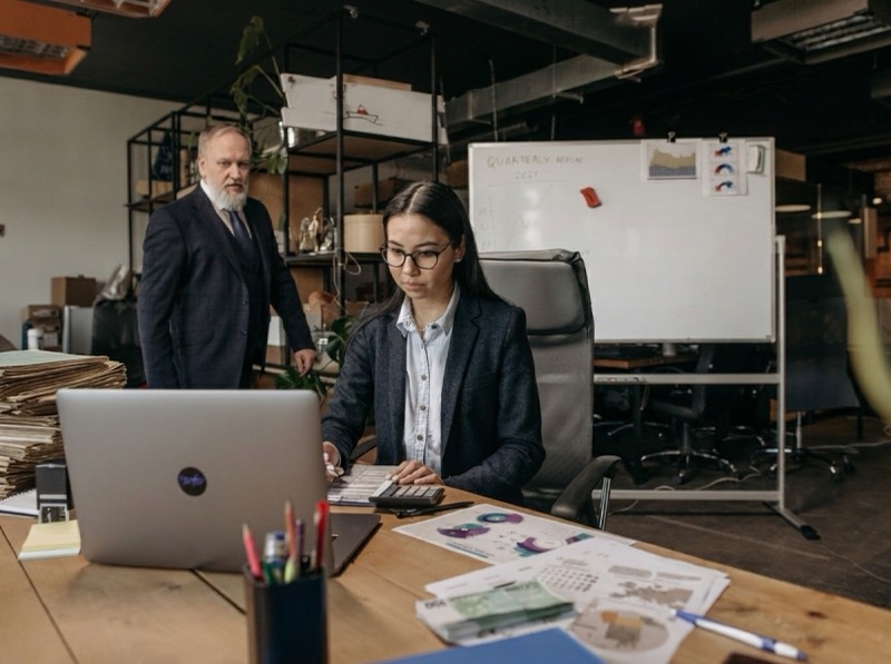 A multi-location practice team reviewing operations on a laptop